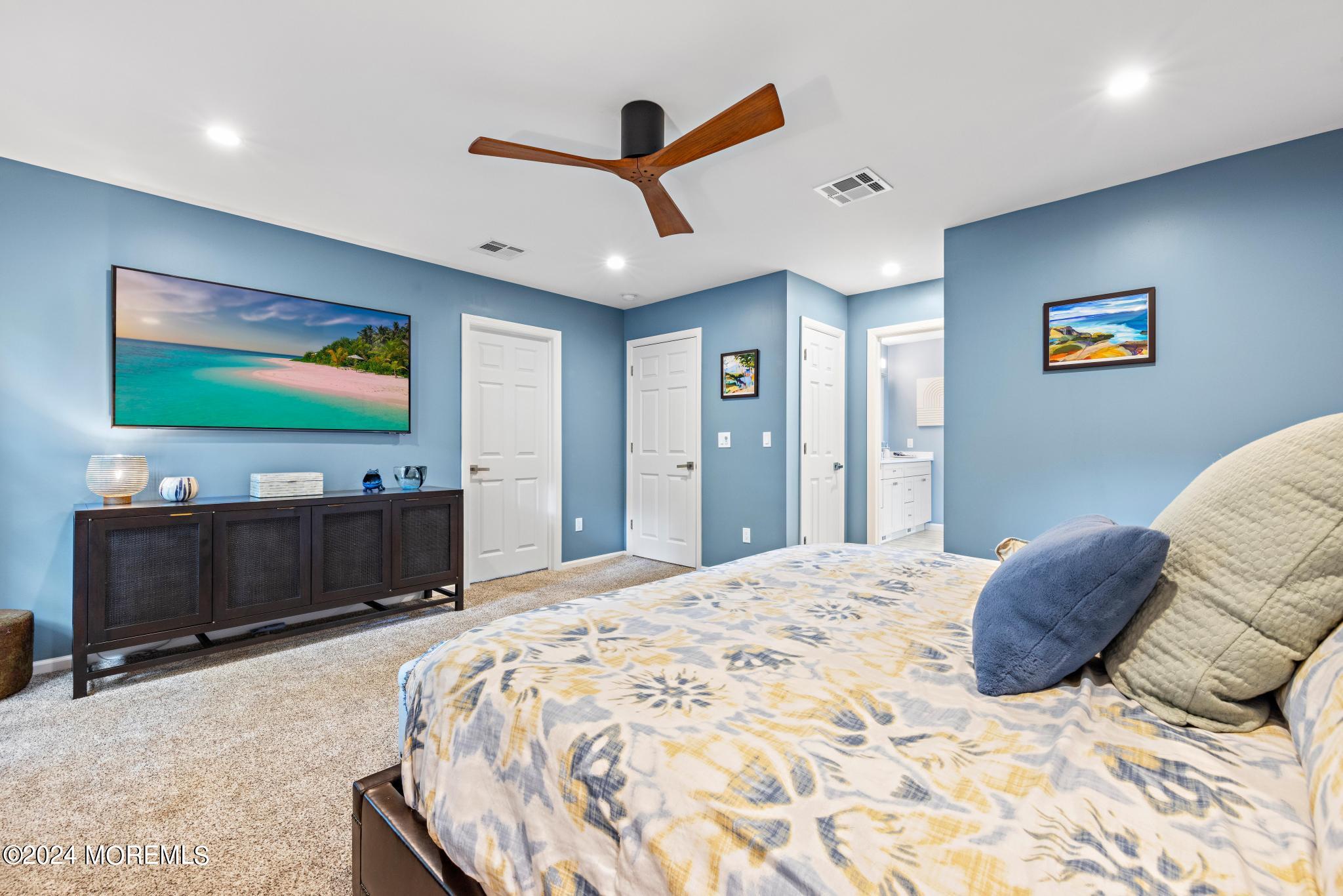 343 Easy Street Howell, NJ 07731 - Photo 22 of 53 a bedroom with a bed and a flat screen tv