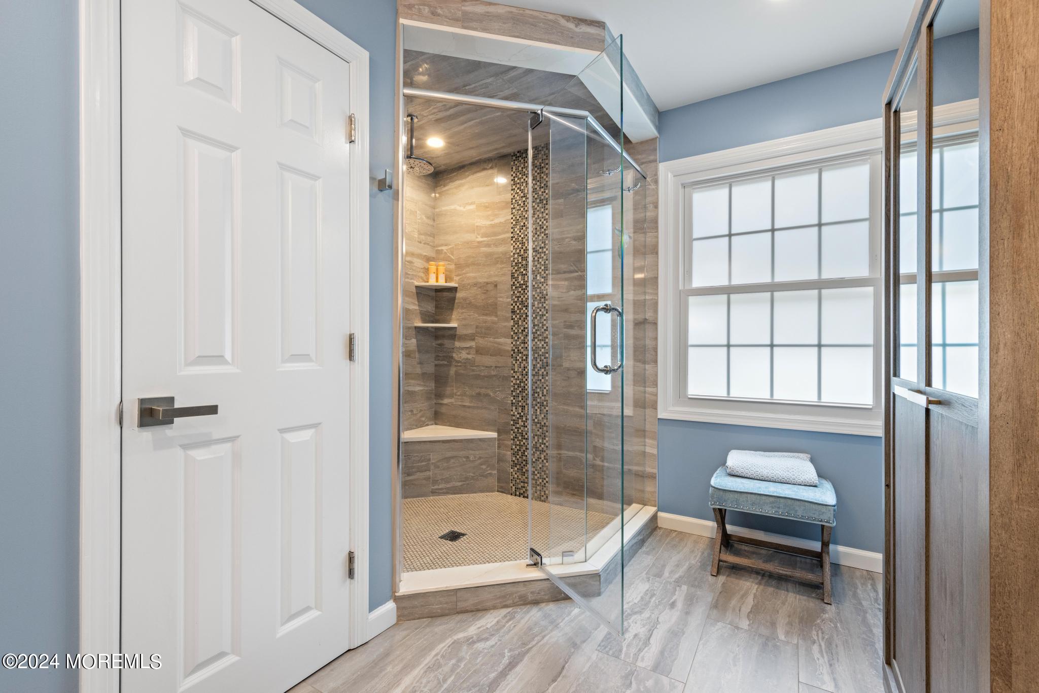 343 Easy Street Howell, NJ 07731 - Photo 24 of 53 a bathroom with a tub shower and window