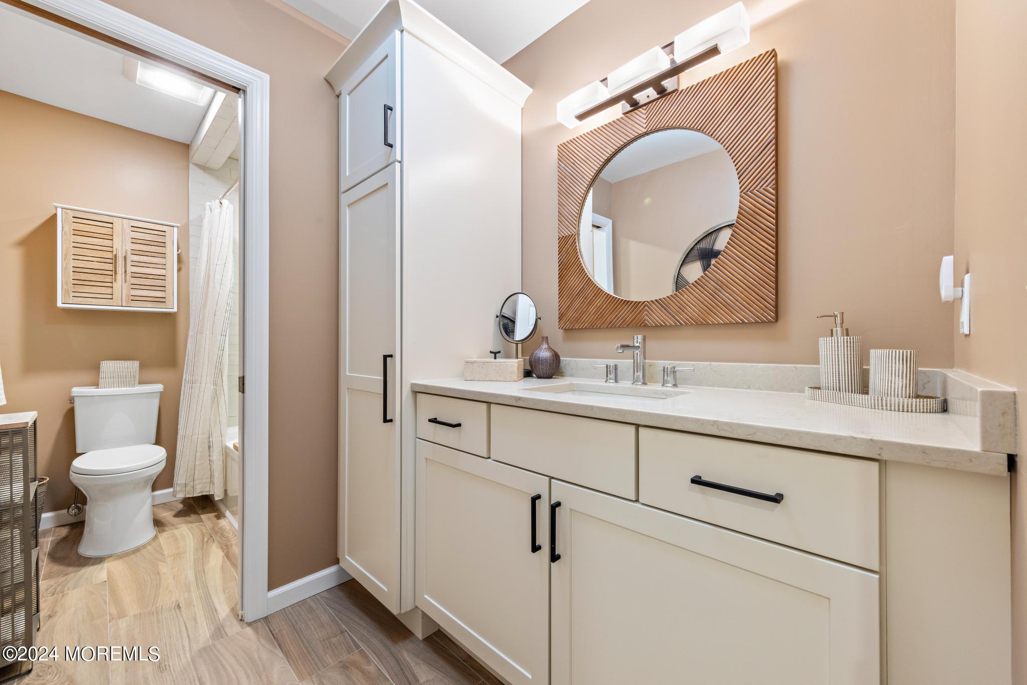 343 Easy Street Howell, NJ 07731 - Photo 26 of 53 a bathroom with a toilet sink and mirror