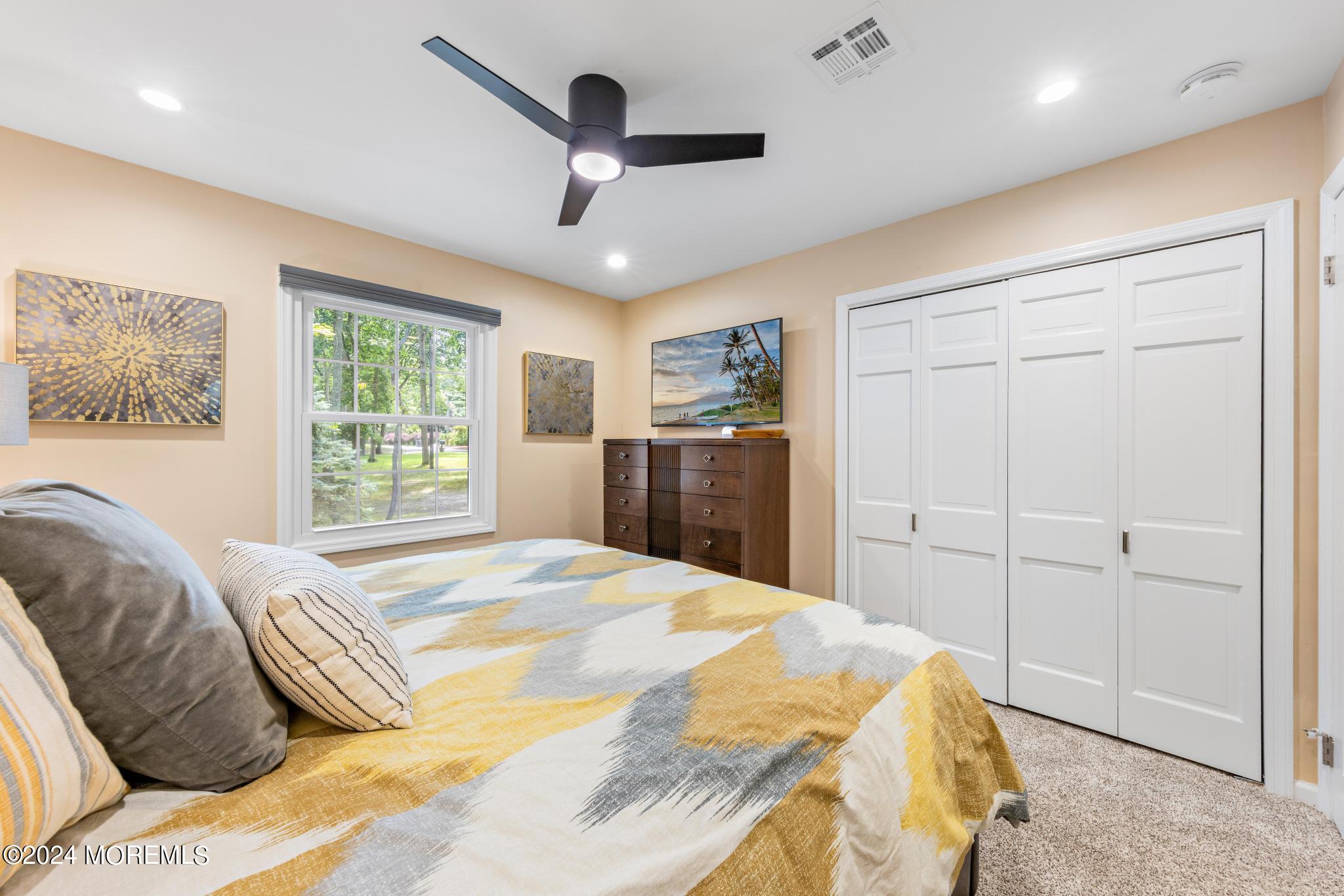 343 Easy Street Howell, NJ 07731 - Photo 28 of 53 a bedroom with a large bed and a window