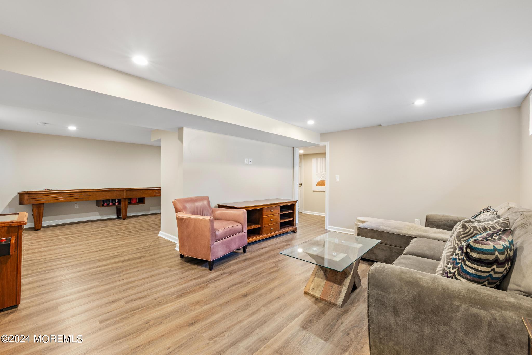 343 Easy Street Howell, NJ 07731 - Photo 33 of 53 a living room with furniture and a wooden floor