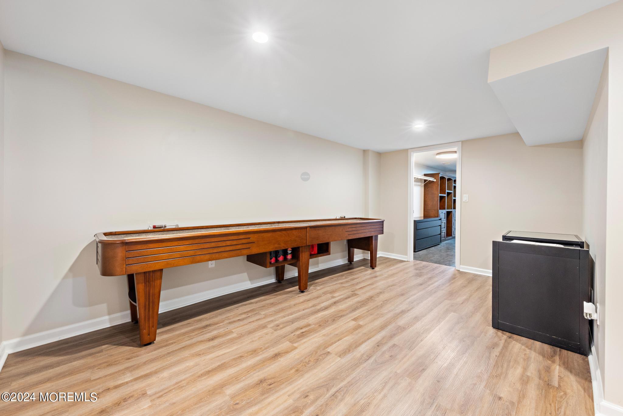 343 Easy Street Howell, NJ 07731 - Photo 34 of 53 a room with wooden floor and furniture