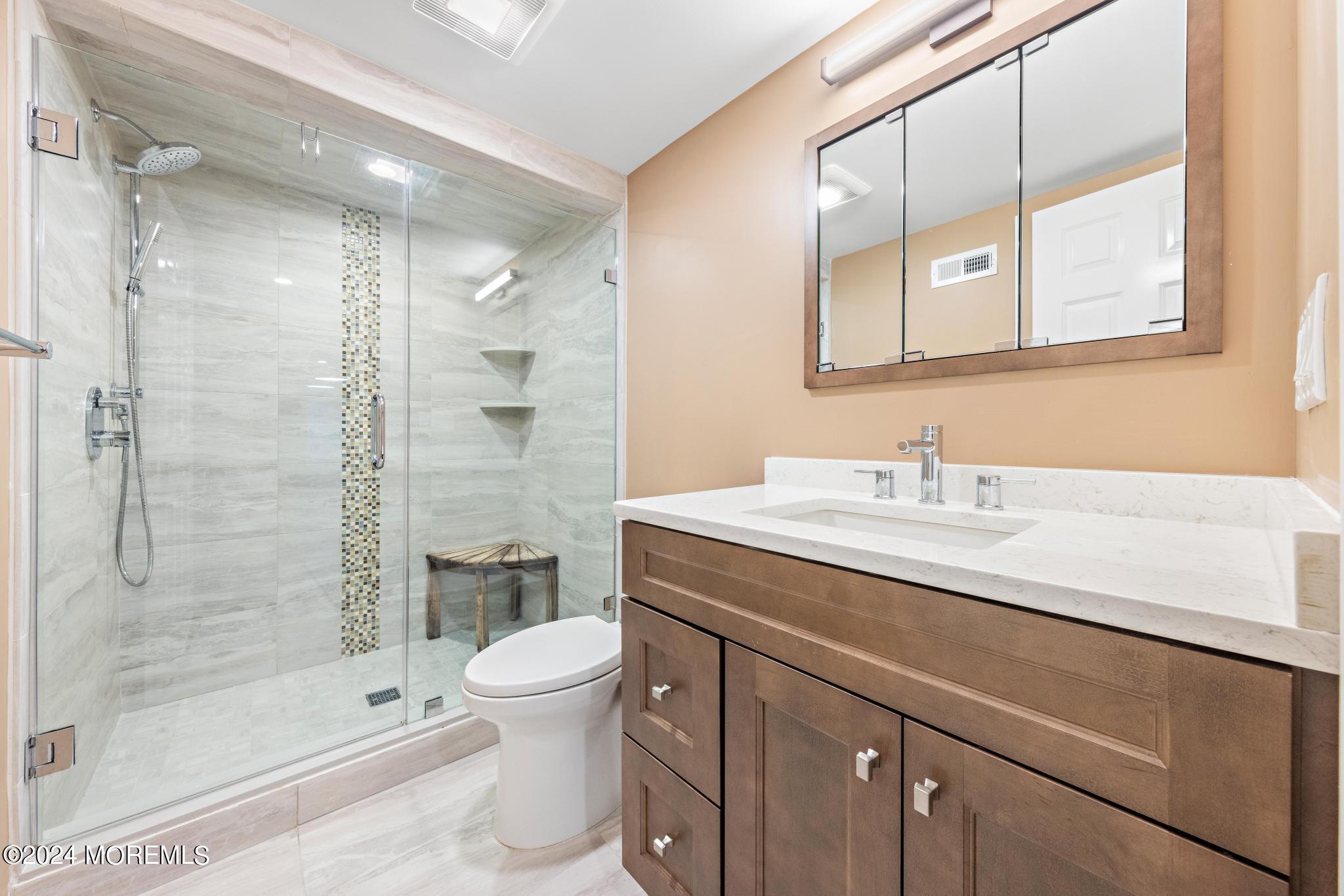 343 Easy Street Howell, NJ 07731 - Photo 35 of 53 a bathroom with a sink a toilet and shower