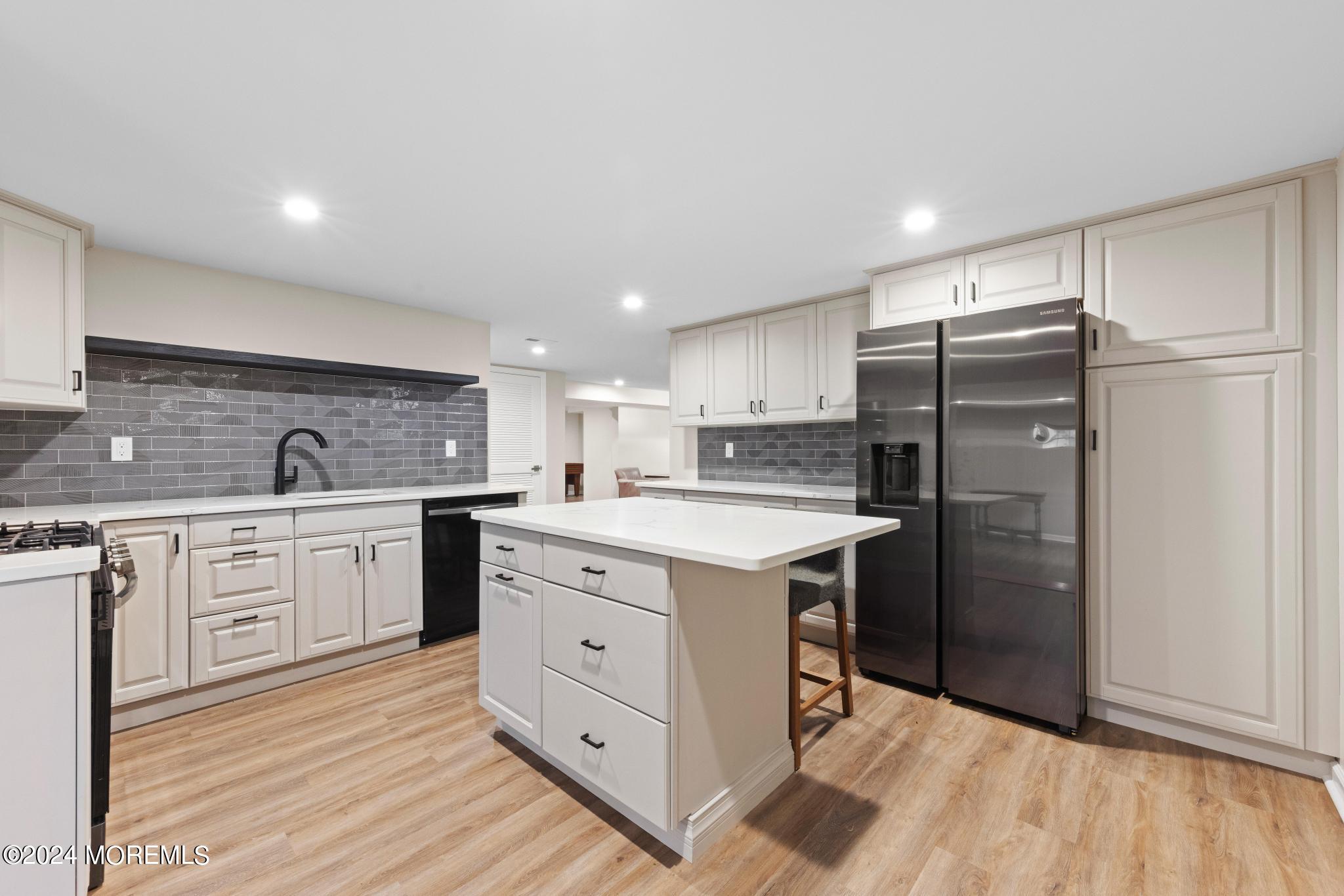 343 Easy Street Howell, NJ 07731 - Photo 38 of 53 a kitchen with a refrigerator sink and cabinets