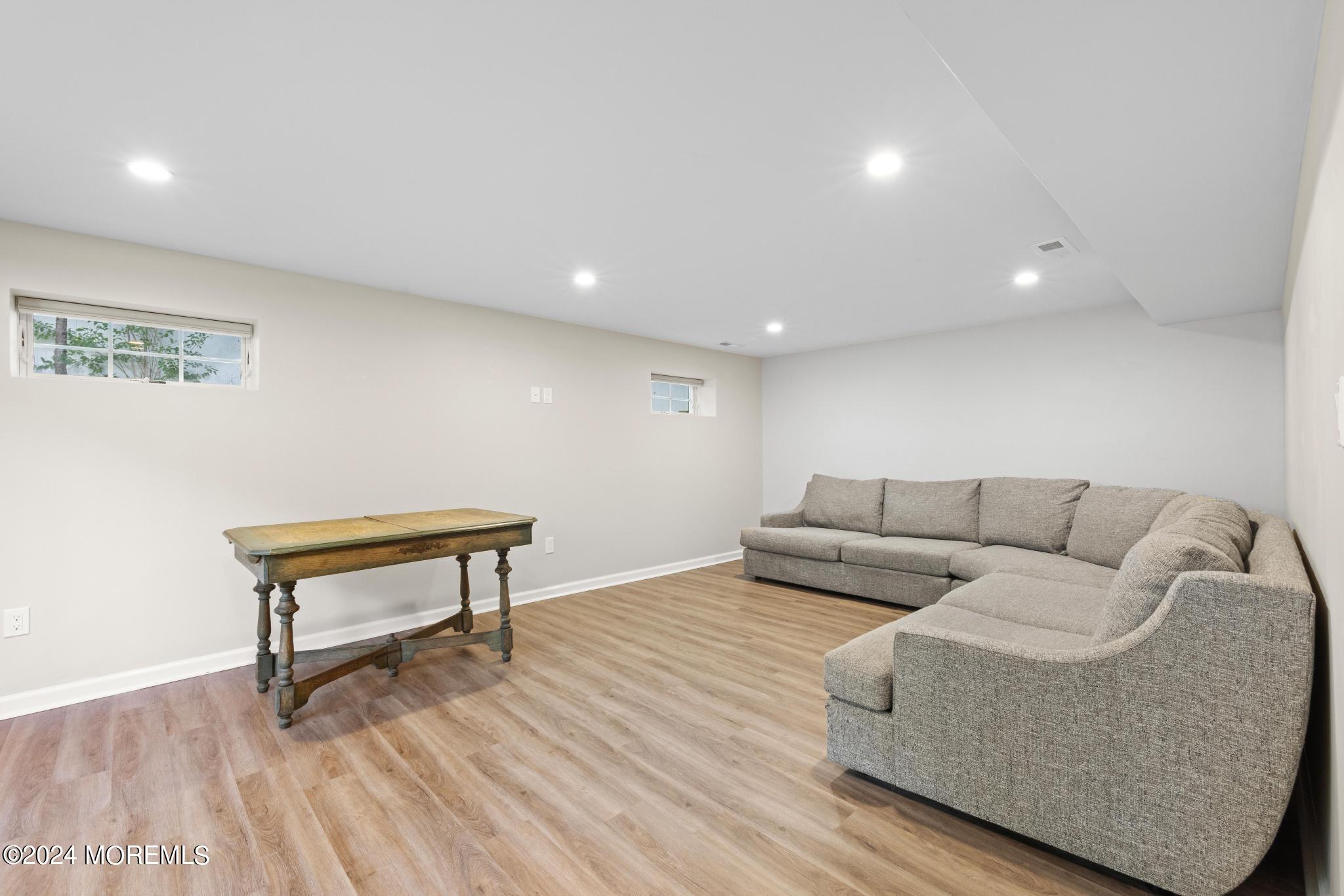 343 Easy Street Howell, NJ 07731 - Photo 40 of 53 a living room with furniture and a wooden floor