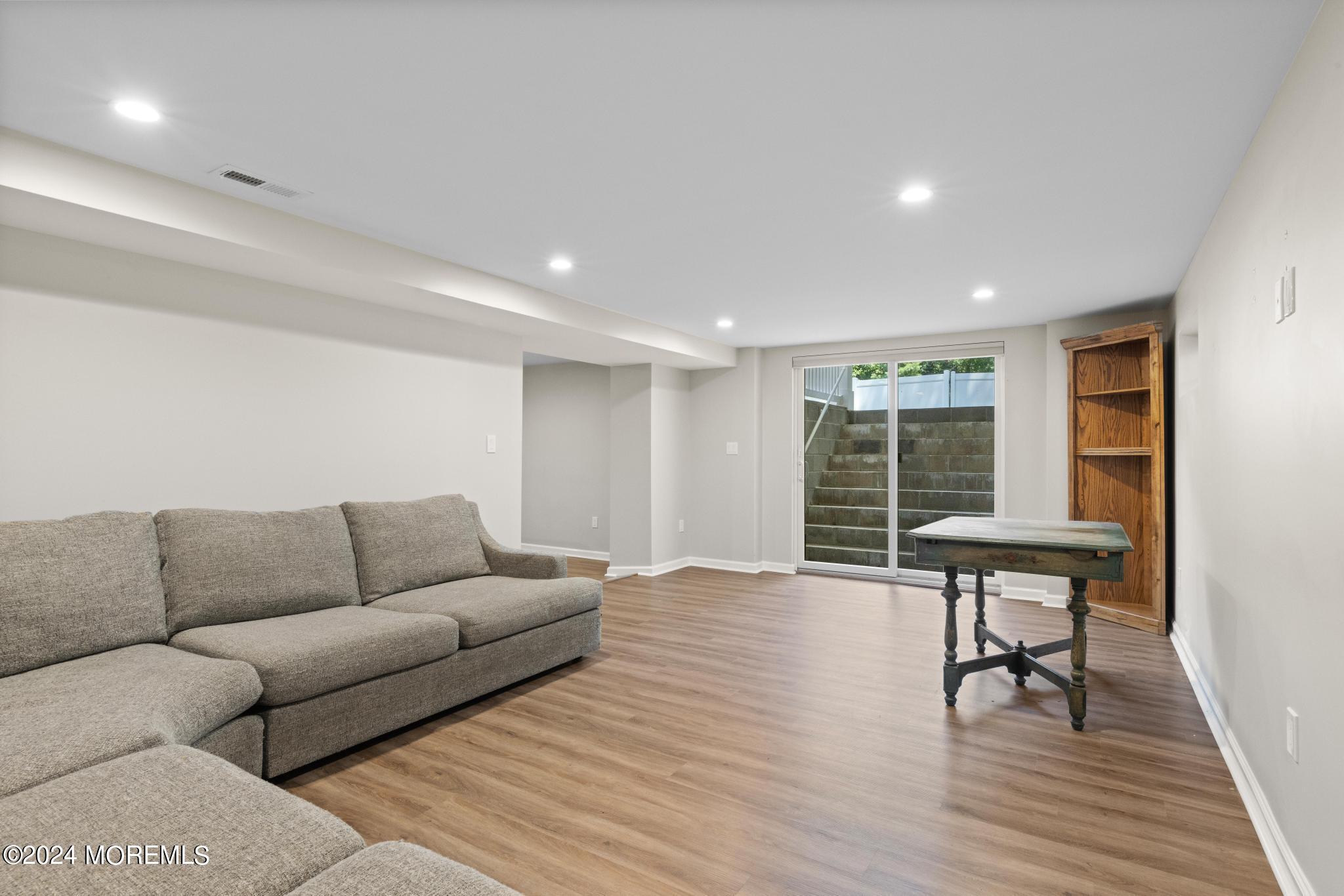 343 Easy Street Howell, NJ 07731 - Photo 41 of 53 a living room with furniture and a window