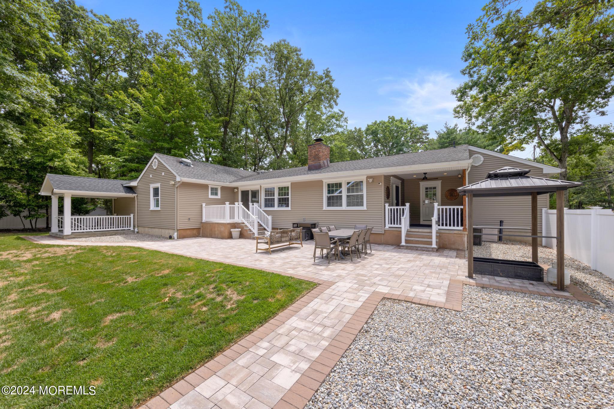 343 Easy Street Howell, NJ 07731 - Photo 44 of 53 a view of a house with swimming pool and sitting area