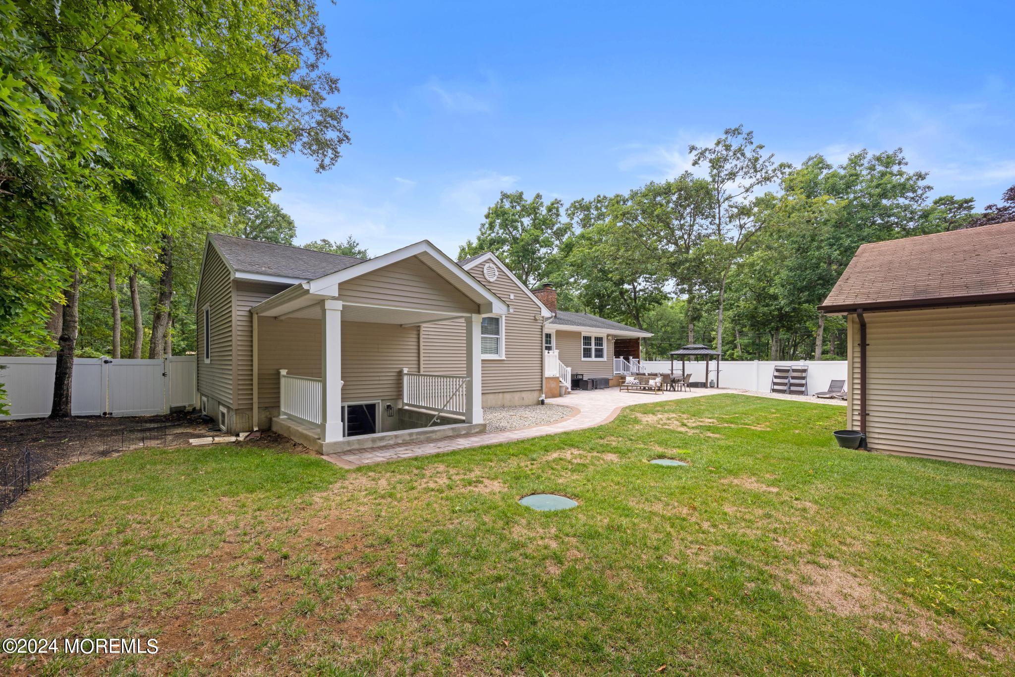 343 Easy Street Howell, NJ 07731 - Photo 45 of 53 a view of a house with a yard and large tree