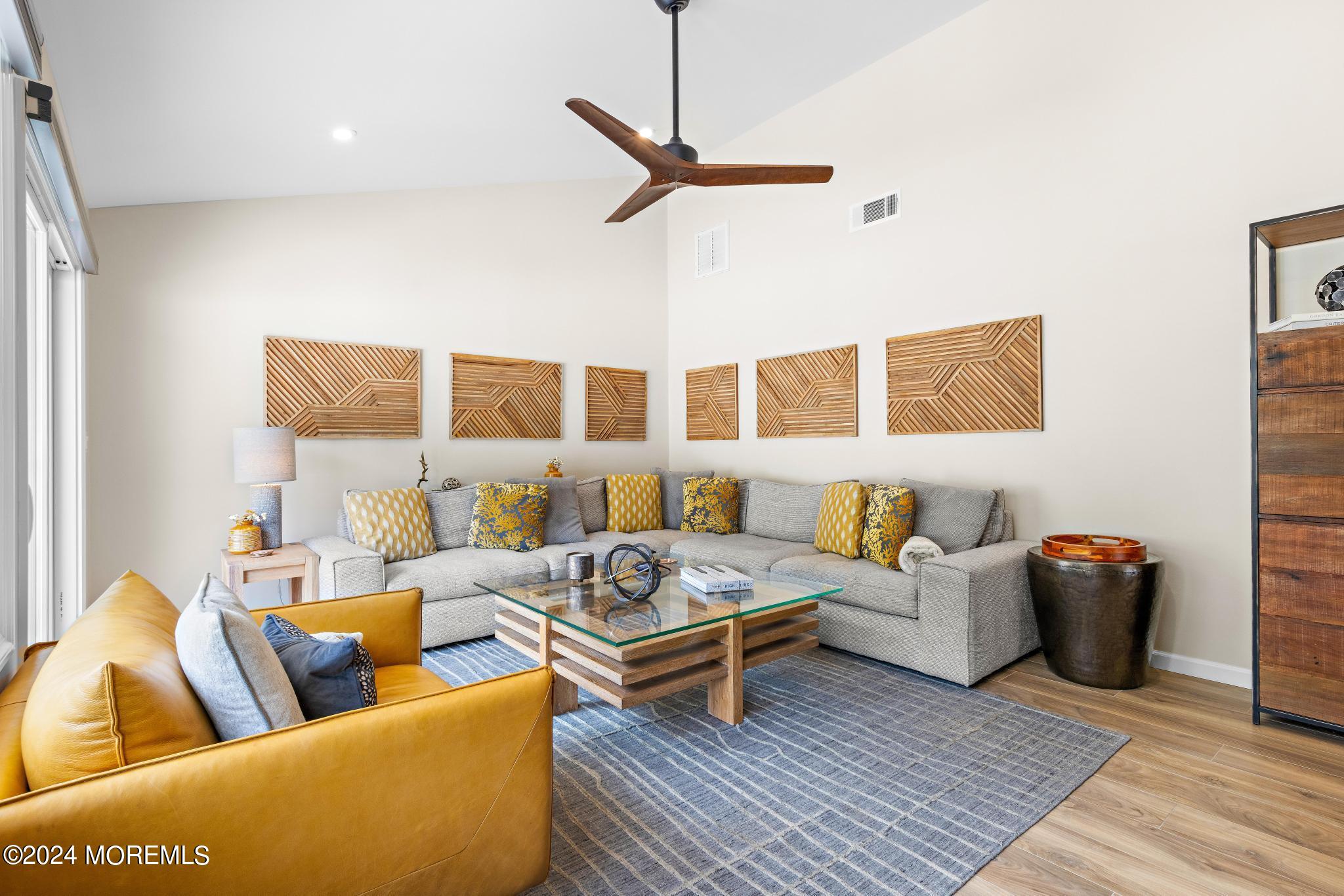 343 Easy Street Howell, NJ 07731 - Photo 6 of 53 a living room with furniture rug and a table