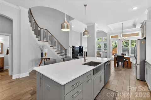 a kitchen with sink and center island