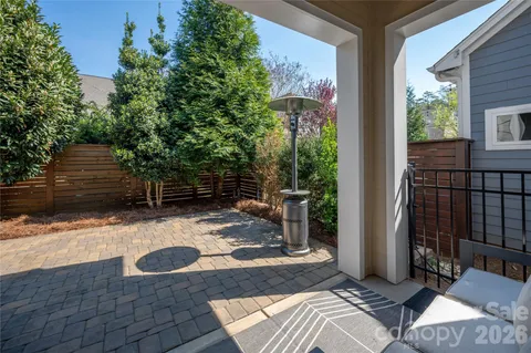 a view of a backyard with sitting area