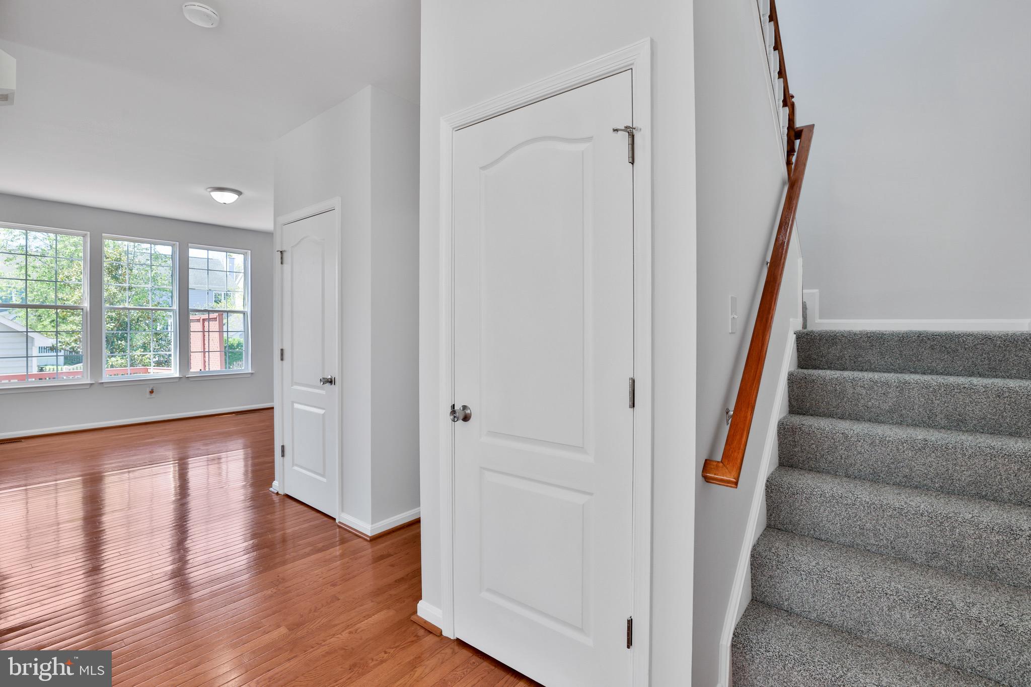 26215 Ocala Circle Chantilly, VA 20152 - Photo 11 of 50 a view of an entryway with wooden floor and staircase