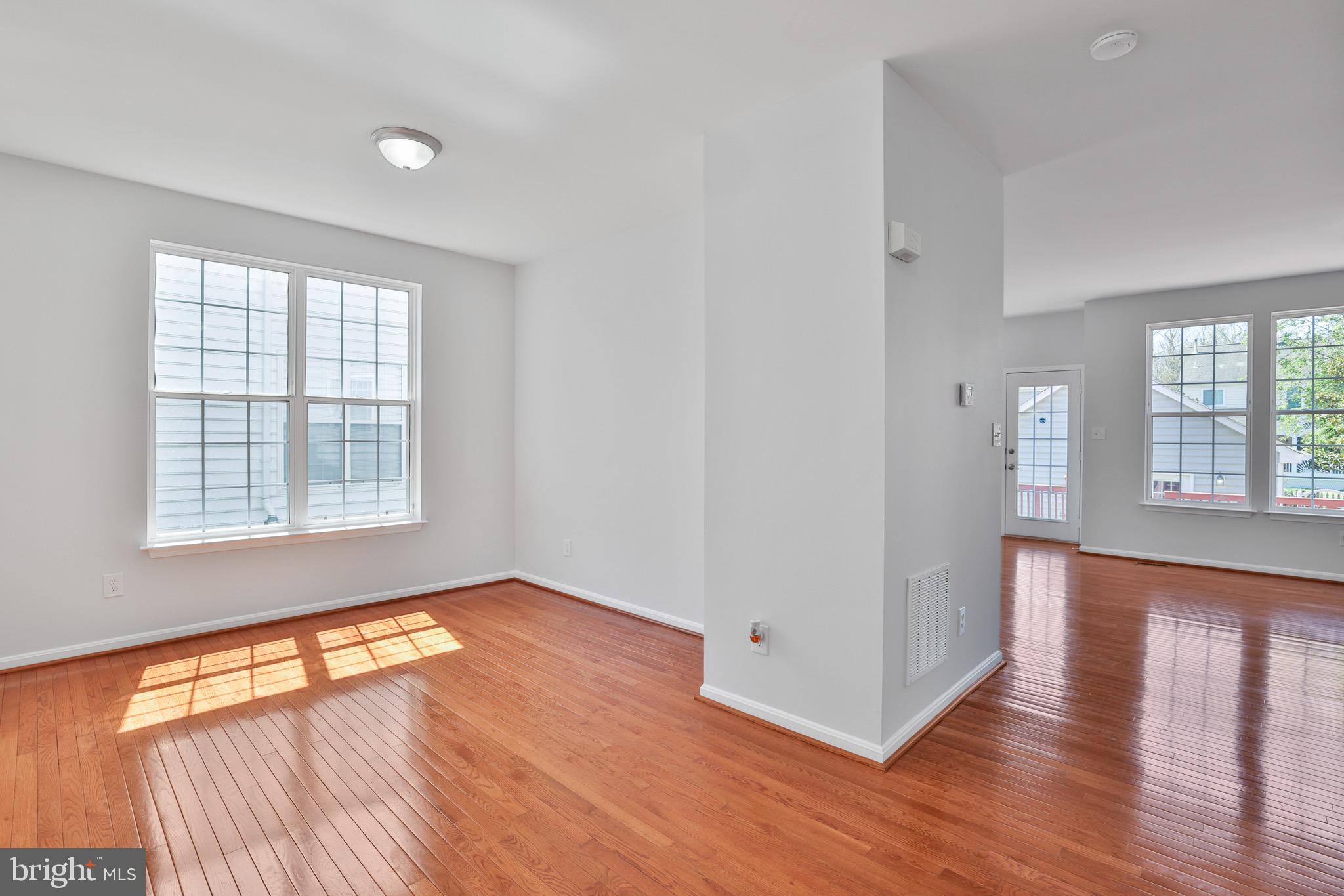 26215 Ocala Circle Chantilly, VA 20152 - Photo 12 of 50 an empty room with wooden floor and windows