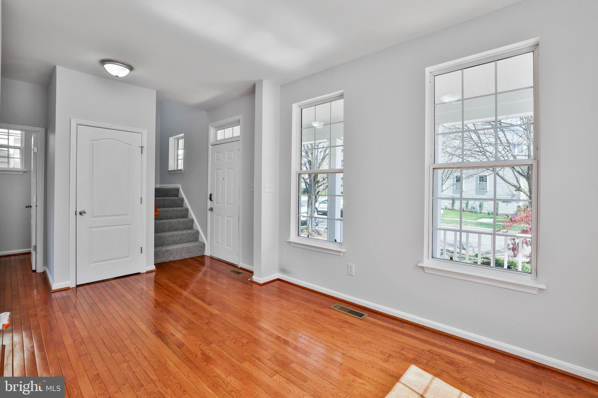 26215 Ocala Circle Chantilly, VA 20152 - Photo 13 of 50 a view of an empty room with wooden floor and a window