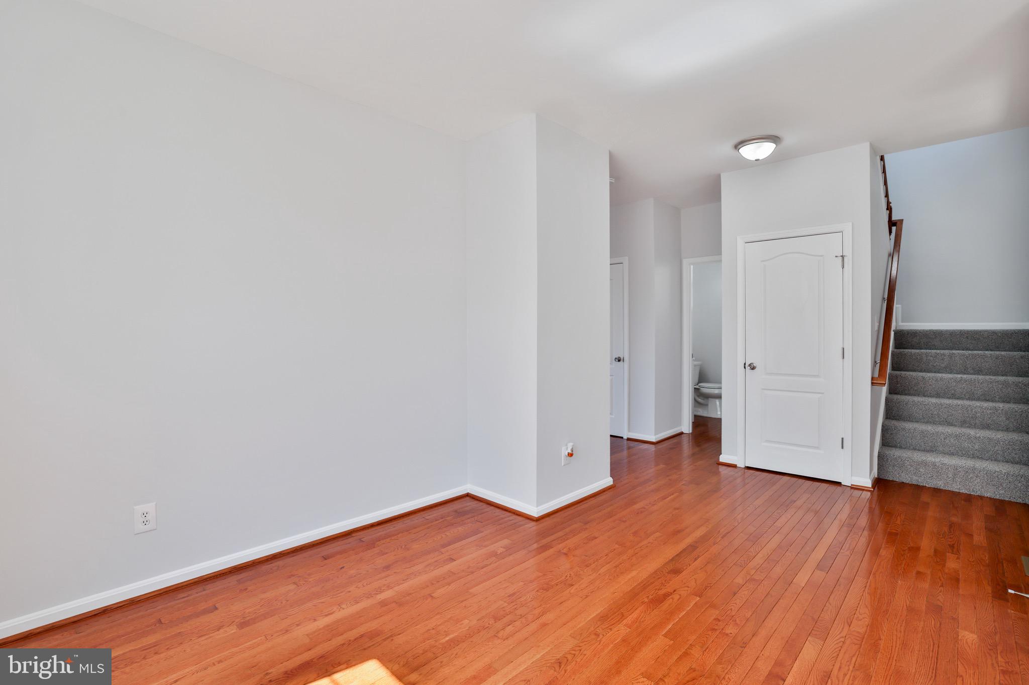 26215 Ocala Circle Chantilly, VA 20152 - Photo 14 of 50 a view of a room with wooden floor and stairs