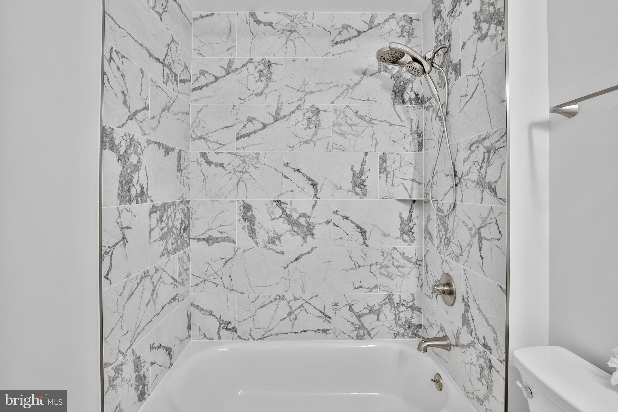 26215 Ocala Circle Chantilly, VA 20152 - Photo 29 of 50 a bathroom with a bathtub and shower