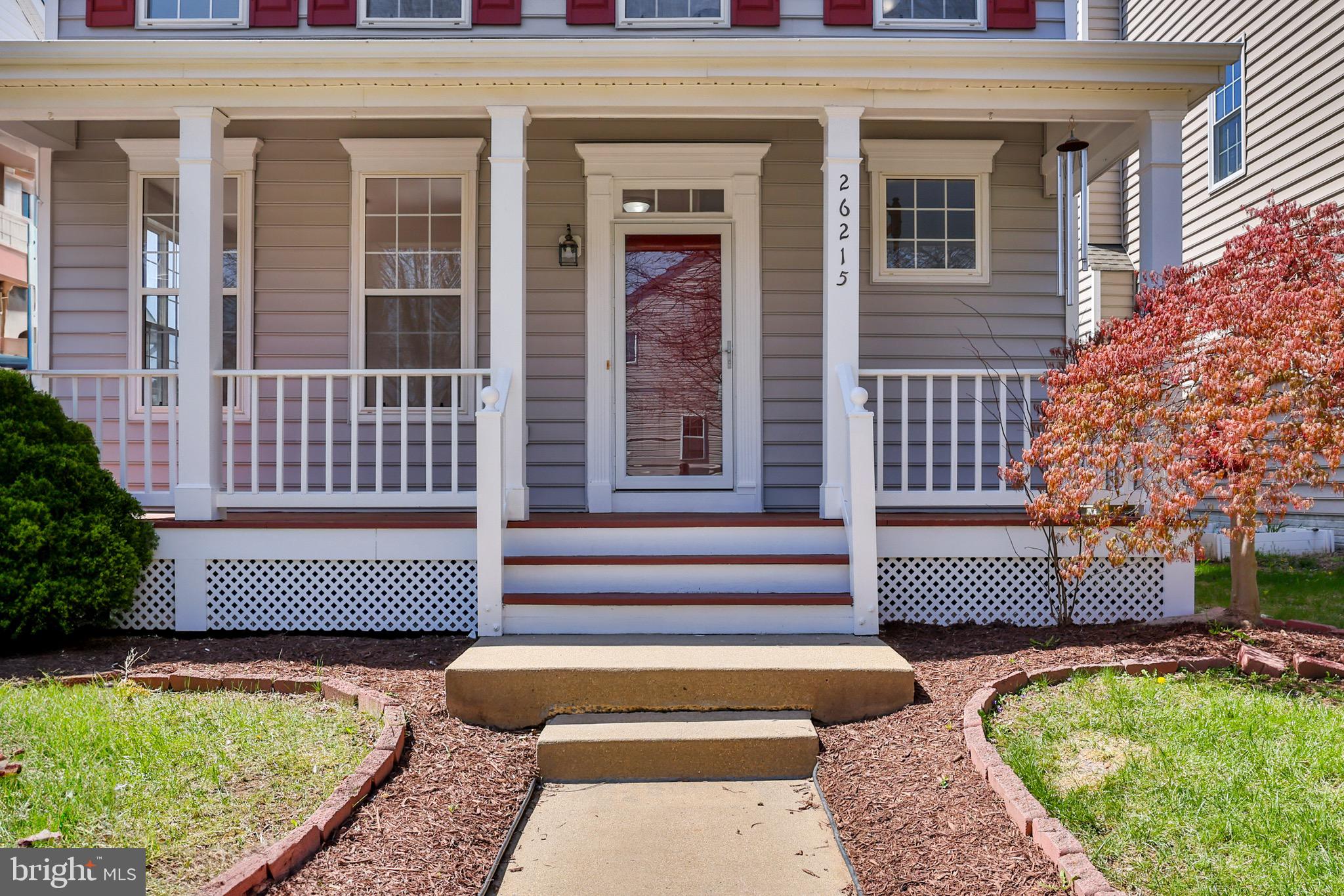 26215 Ocala Circle Chantilly, VA 20152 - Photo 3 of 50 a front view of a house with garden