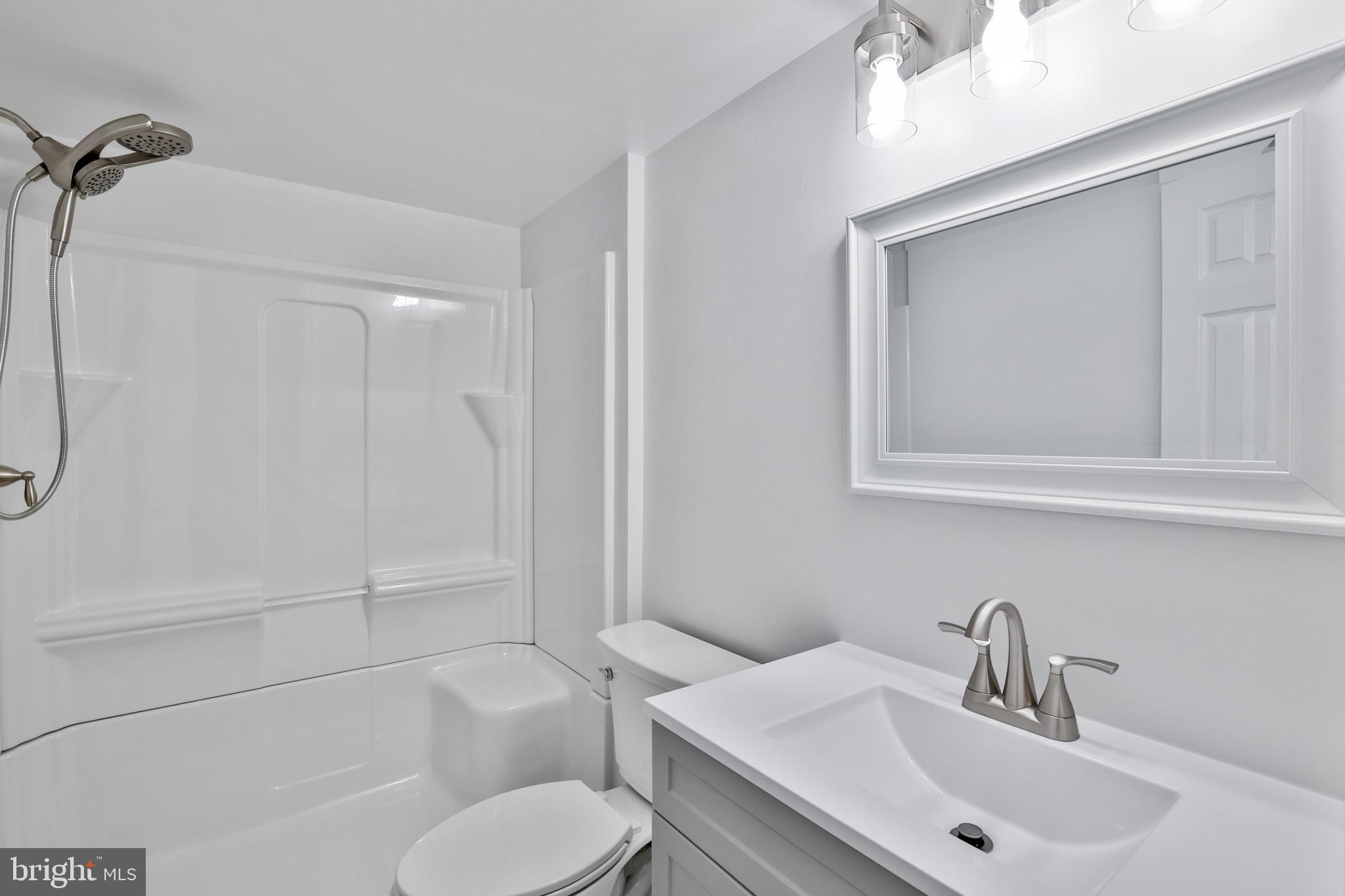 26215 Ocala Circle Chantilly, VA 20152 - Photo 38 of 50 a bathroom with a toilet sink and shower