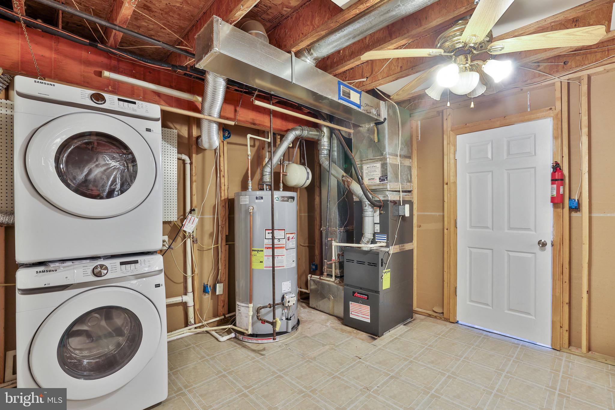 26215 Ocala Circle Chantilly, VA 20152 - Photo 40 of 50 a view of a storage & utility room with washer and dryer