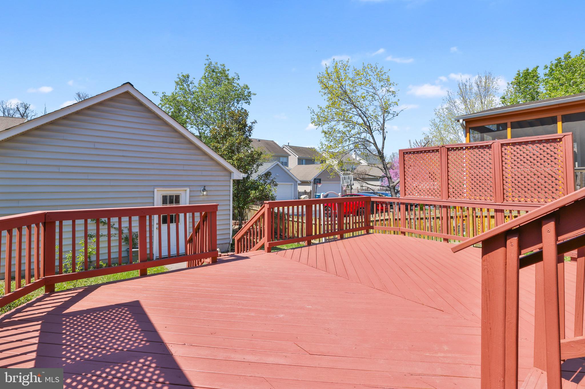 26215 Ocala Circle Chantilly, VA 20152 - Photo 42 of 50 a view of a balcony with wooden floor and fence