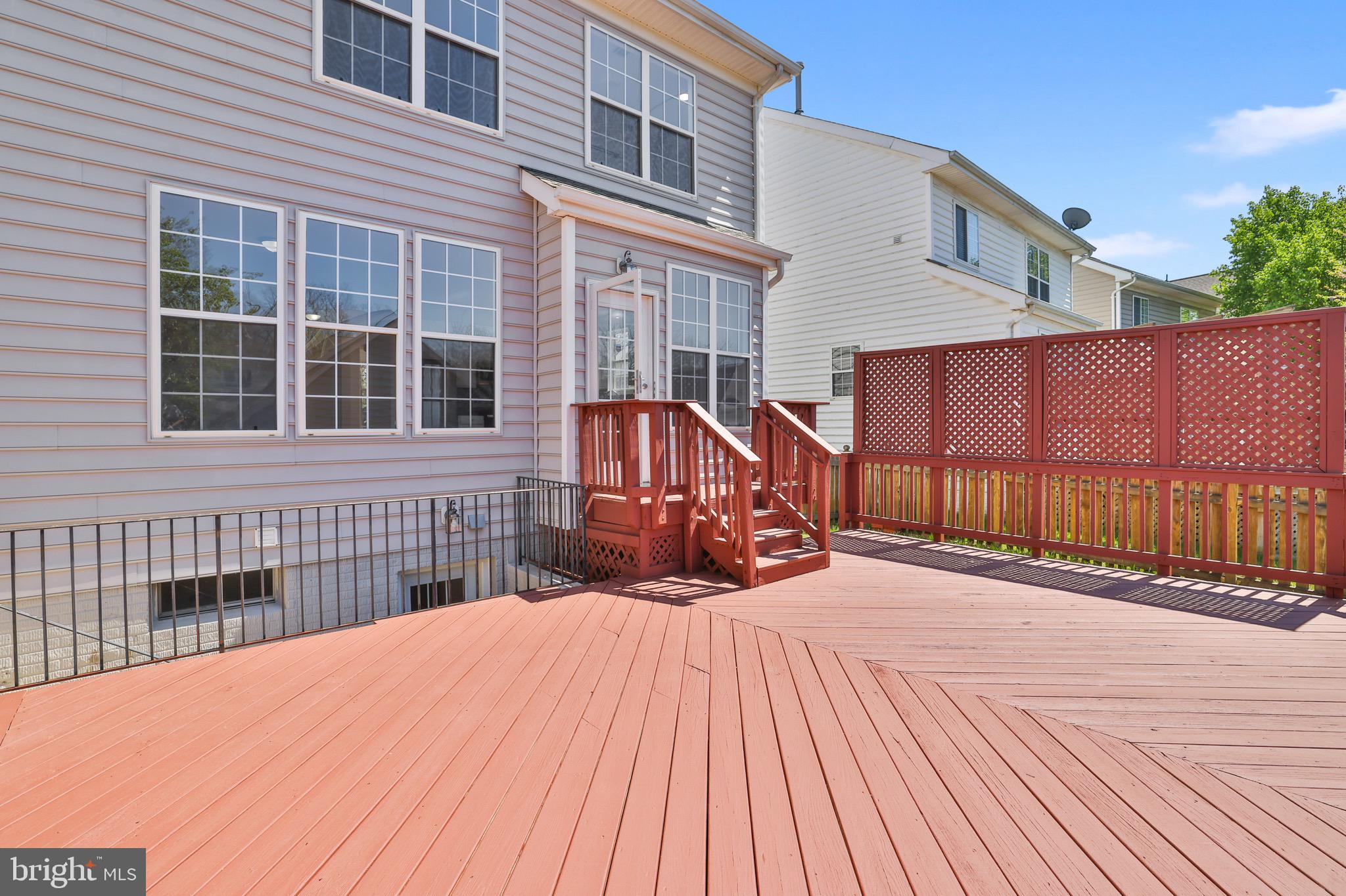 26215 Ocala Circle Chantilly, VA 20152 - Photo 43 of 50 a view of a house with wooden floor and a yard