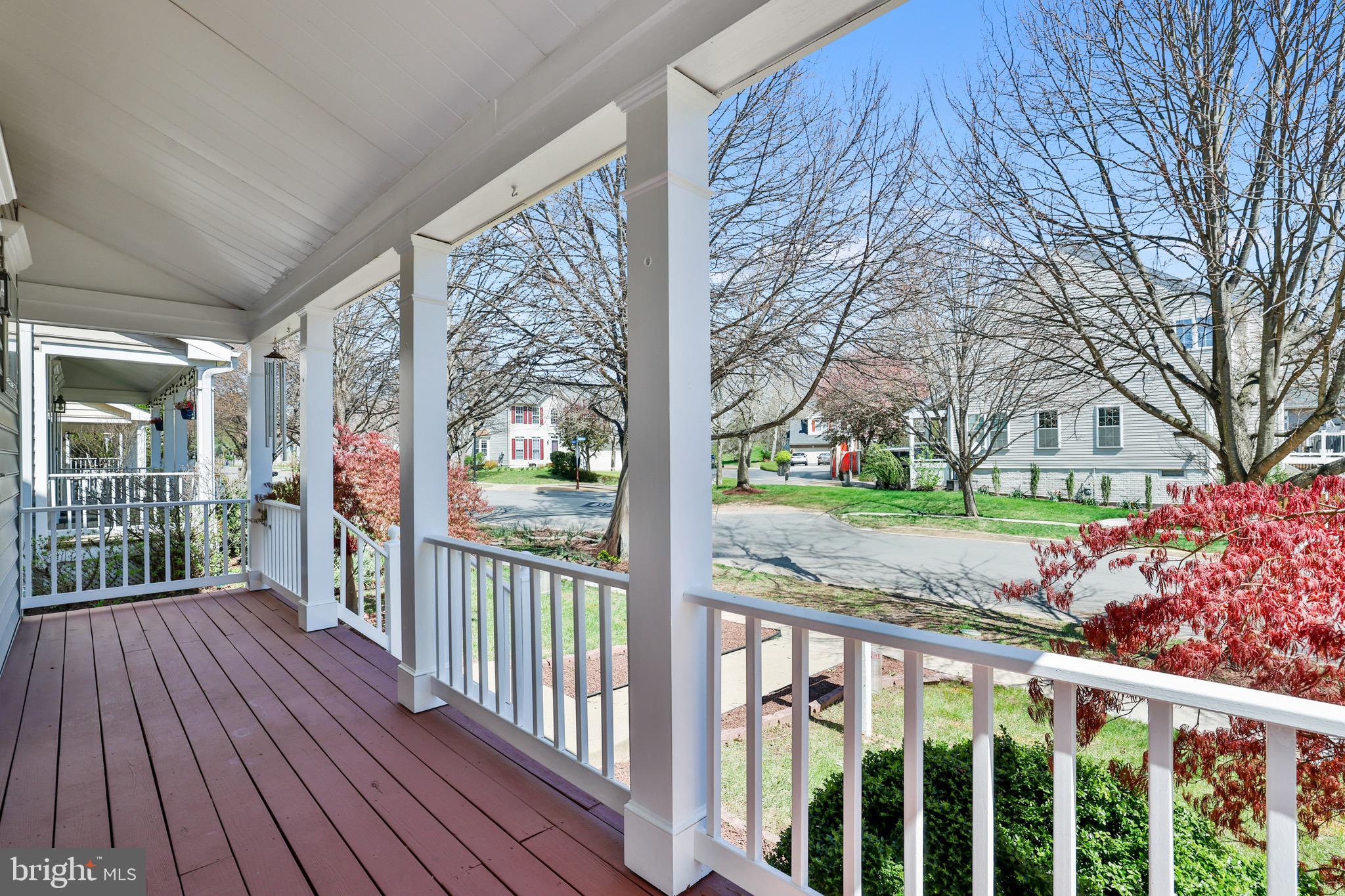 26215 Ocala Circle Chantilly, VA 20152 - Photo 7 of 50 a view of a porch with wooden floor and fence