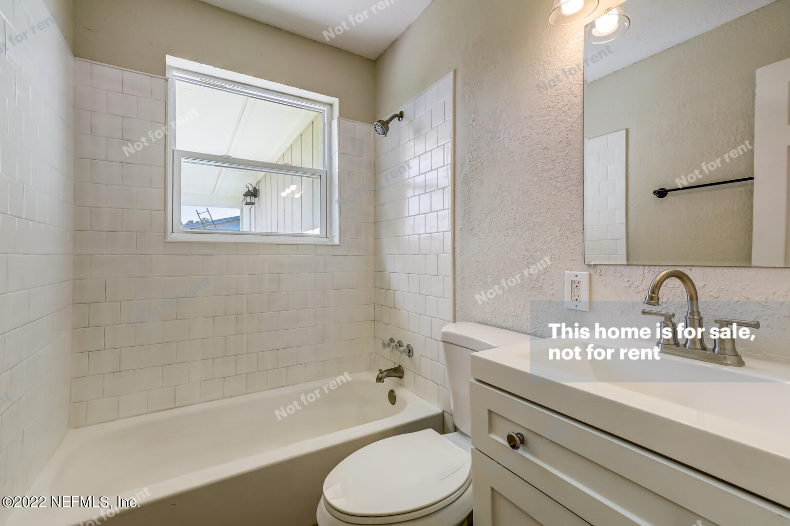 5634 Sabena Road Jacksonville, FL 32207 - Photo 17 of 22 a bathroom with a granite countertop toilet sink and bathtub