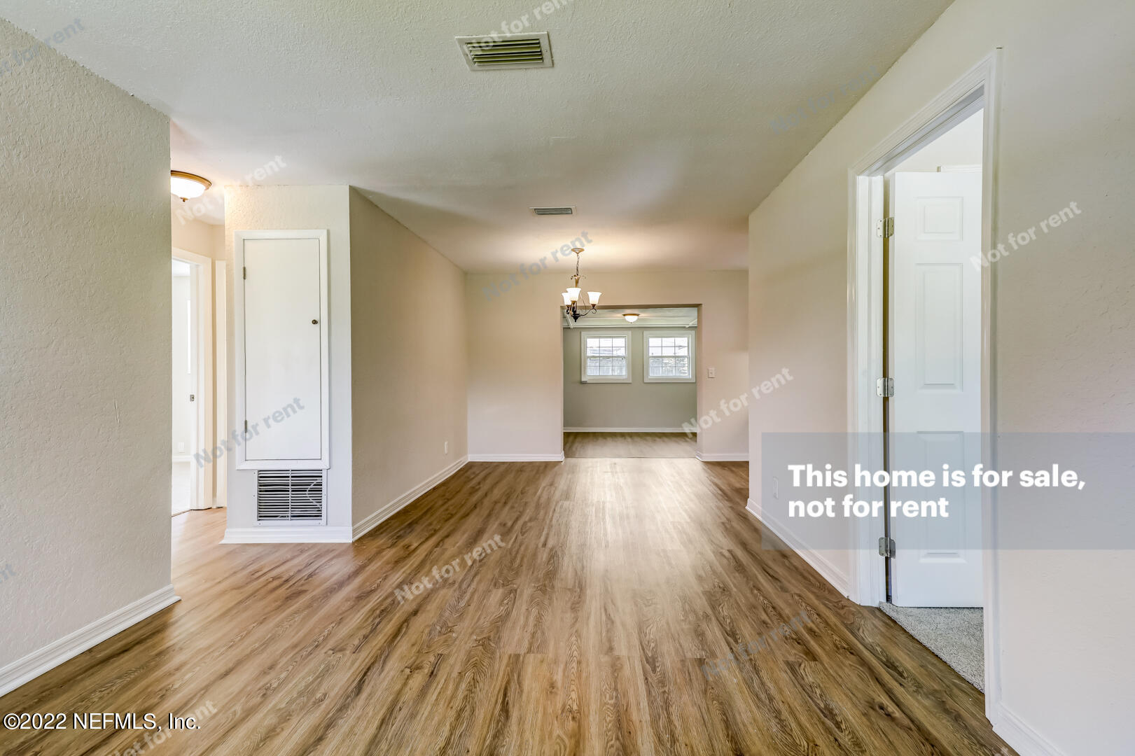5634 Sabena Road Jacksonville, FL 32207 - Photo 5 of 22 a view of a big room with wooden floor and windows