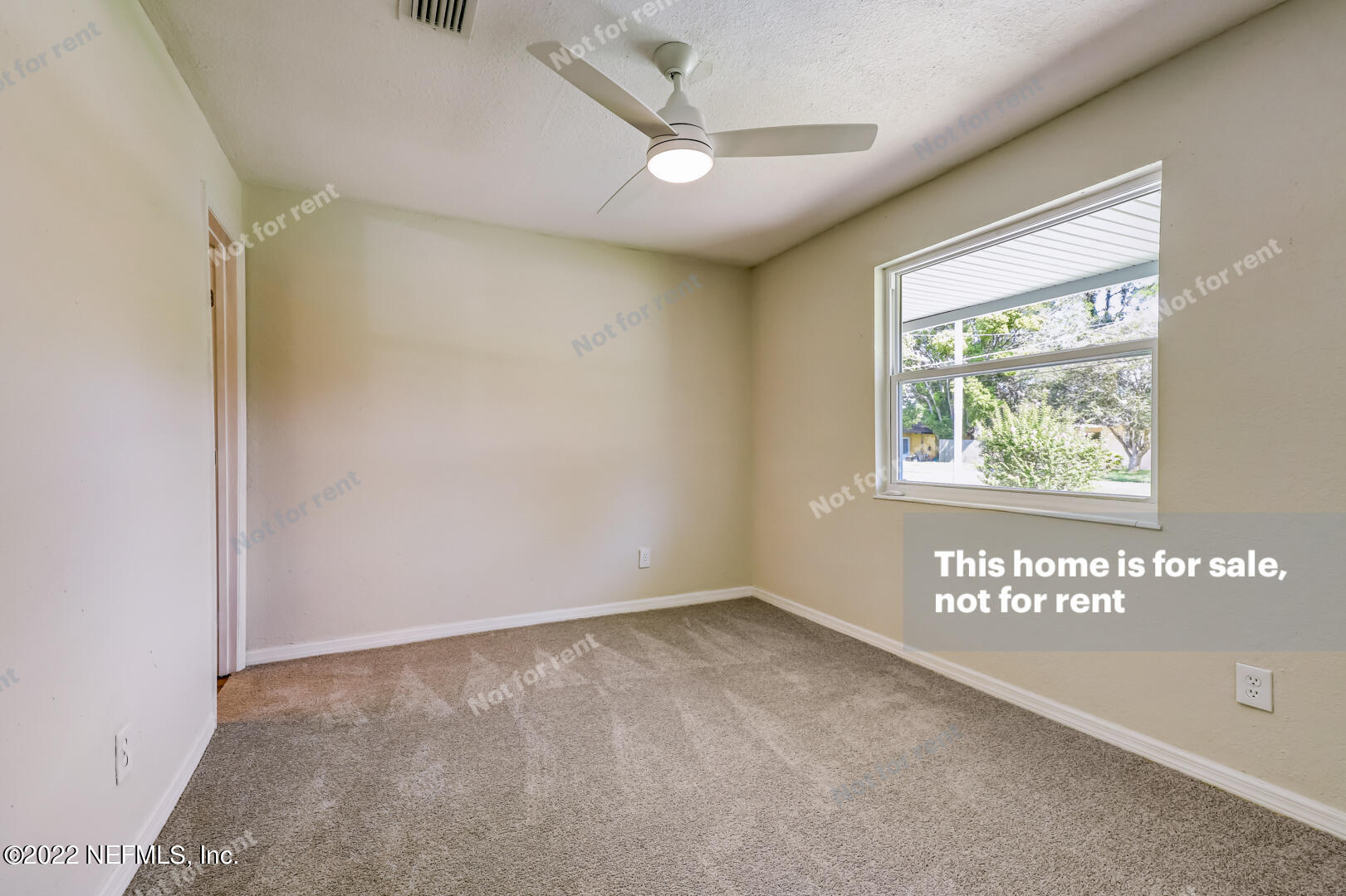 5634 Sabena Road Jacksonville, FL 32207 - Photo 7 of 22 a view of an empty room with a window