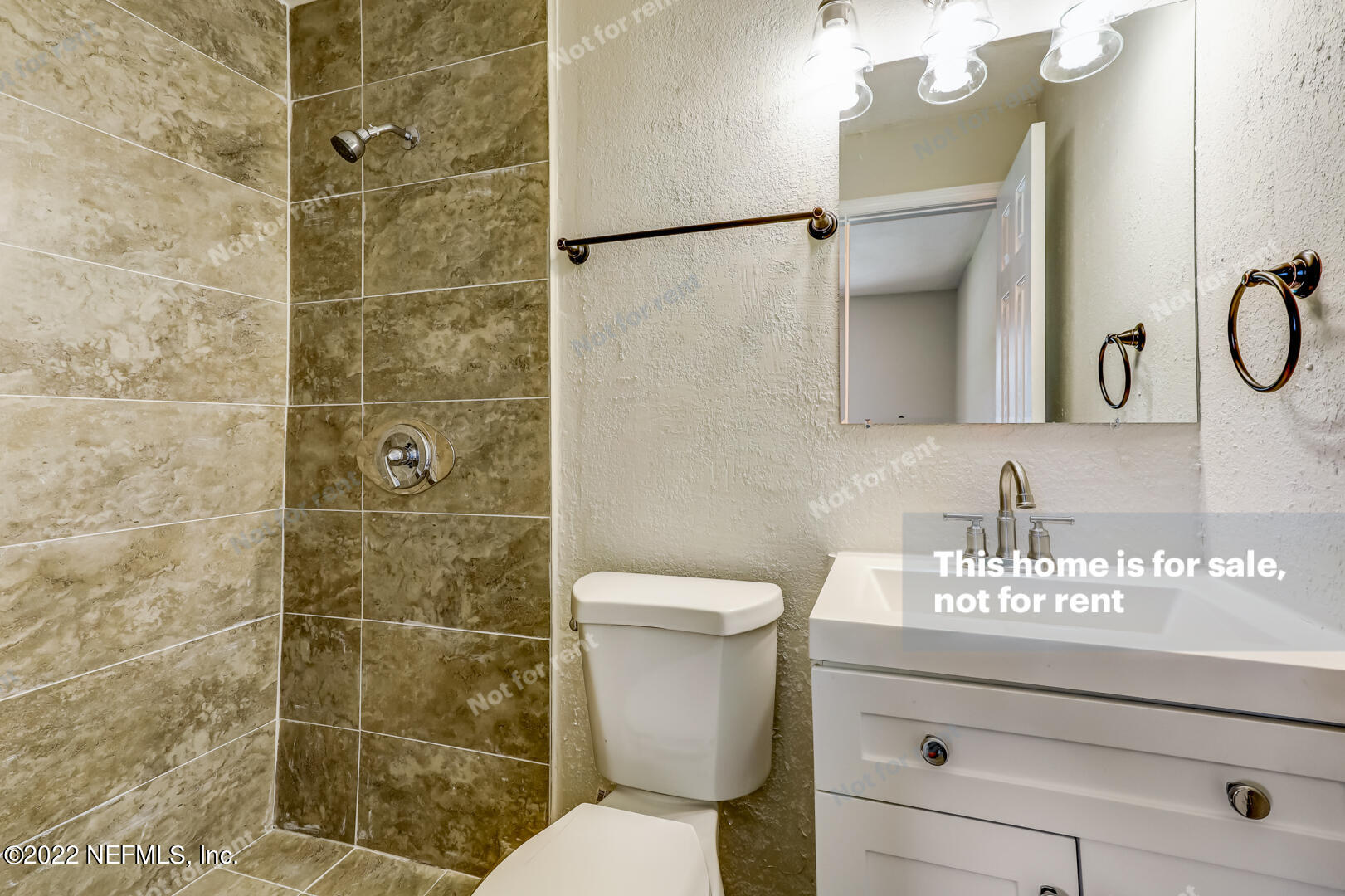 5634 Sabena Road Jacksonville, FL 32207 - Photo 8 of 22 a bathroom with a granite countertop sink toilet and shower