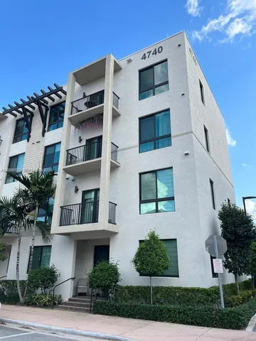 a front view of a multi story residential apartment building