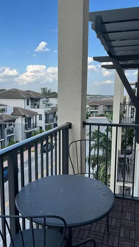 a view of a balcony dining area