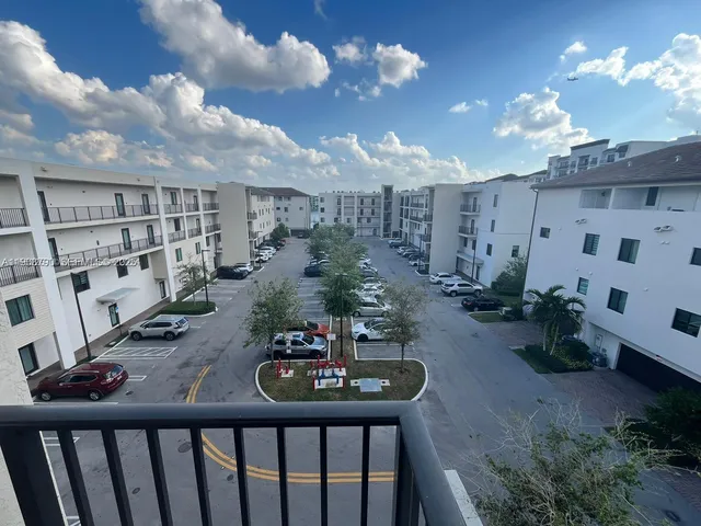 a view of a balcony dining room and hall with furniture