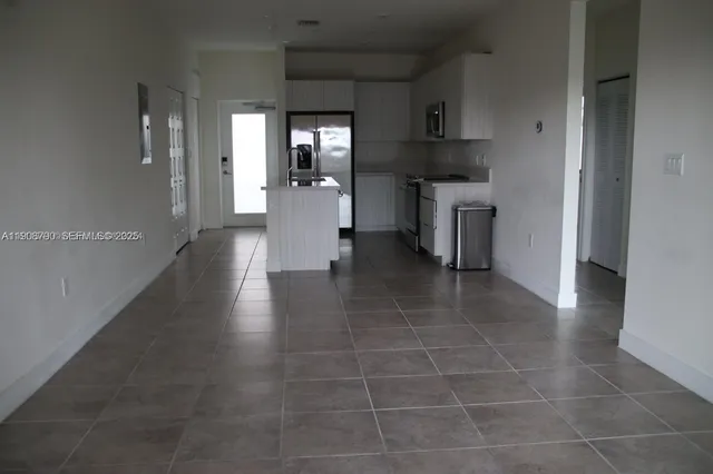 a view of a kitchen with a sink