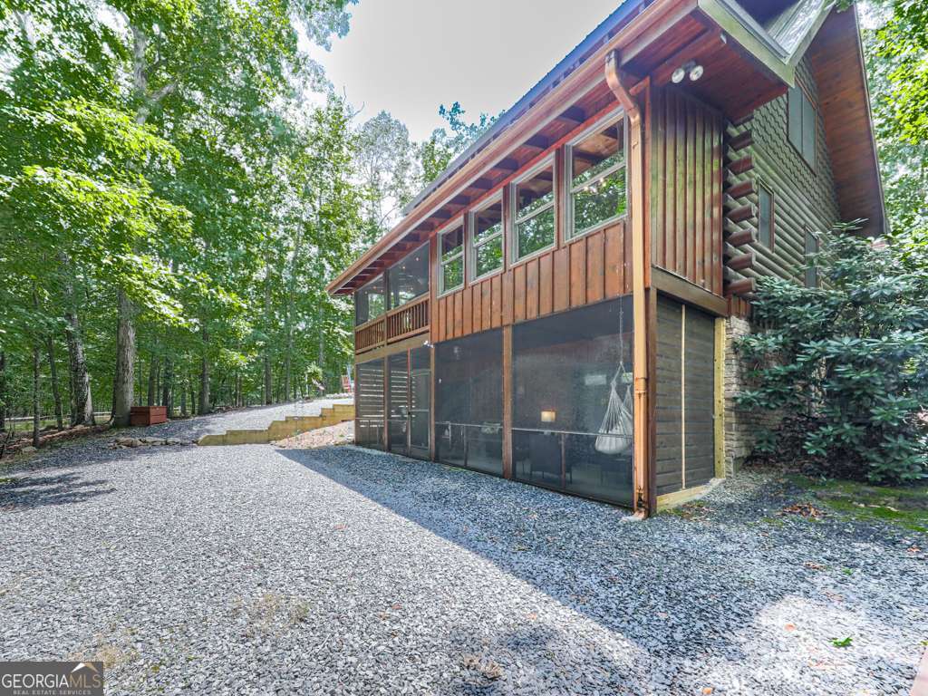 34 Amber Way, Unit 1 Morganton, GA 30560 - Photo 34 of 39 a view of a house with a yard plants and large tree