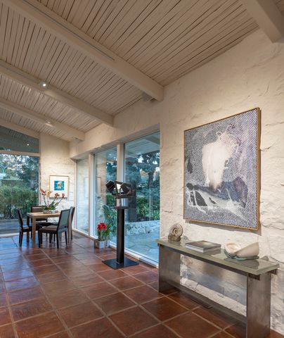 a dining room with furniture and a fireplace