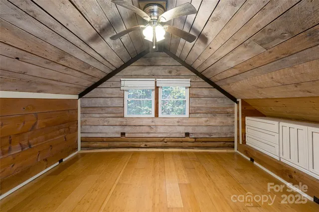 a view of a patio with table and chairs potted plants with wooden floor
