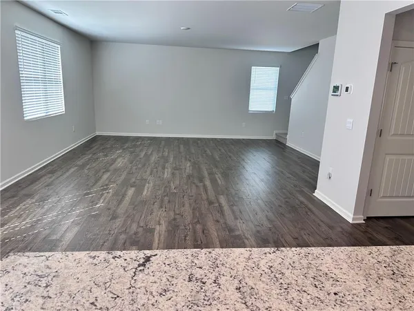 wooden floor in a hall with an entryway