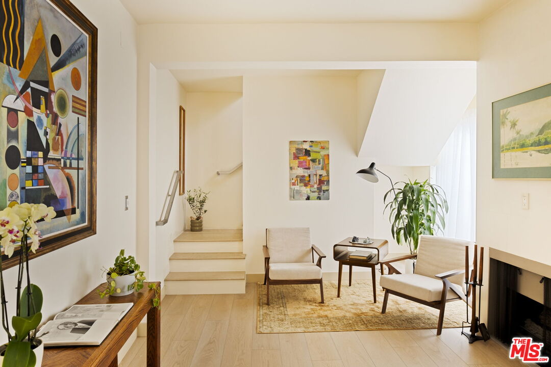1717 Malcolm Avenue, Unit 303 Los Angeles, CA 90024 - Photo 14 of 34 a living room with furniture and a flat screen tv