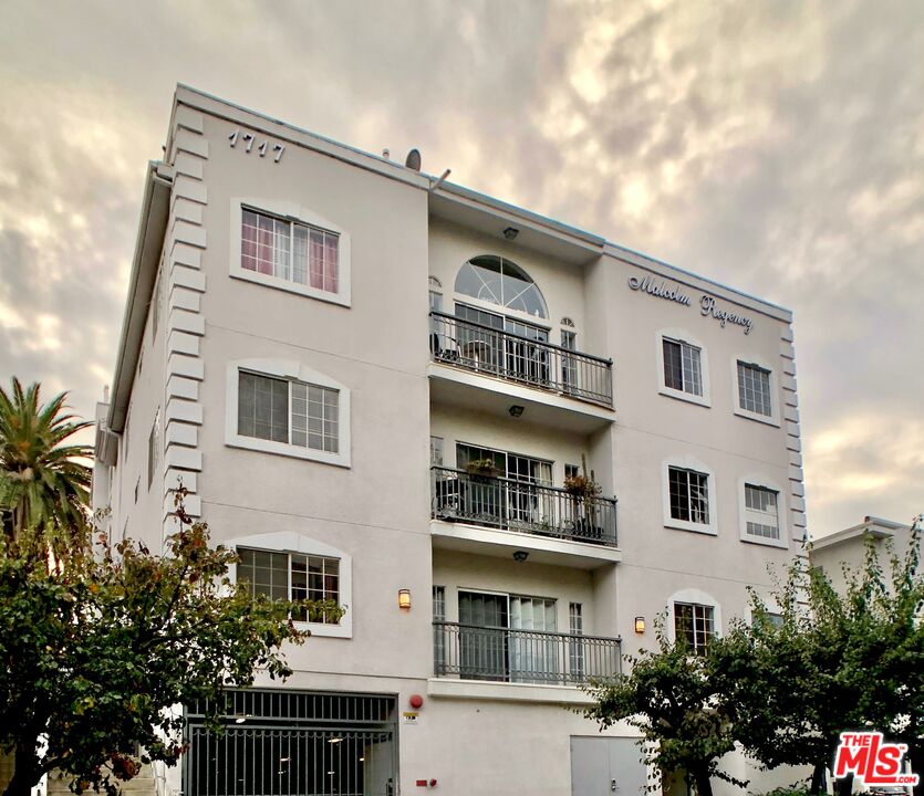 1717 Malcolm Avenue, Unit 303 Los Angeles, CA 90024 - Photo 34 of 34 a front view of a building with plants