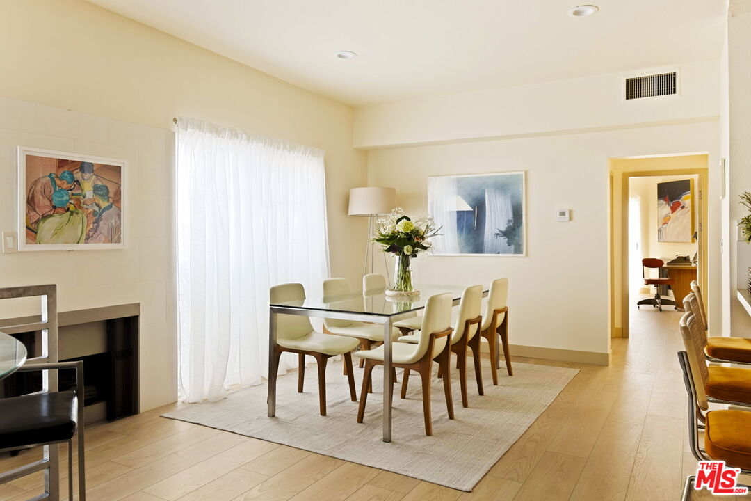 1717 Malcolm Avenue, Unit 303 Los Angeles, CA 90024 - Photo 7 of 34 a view of a dining room with furniture and wooden floor