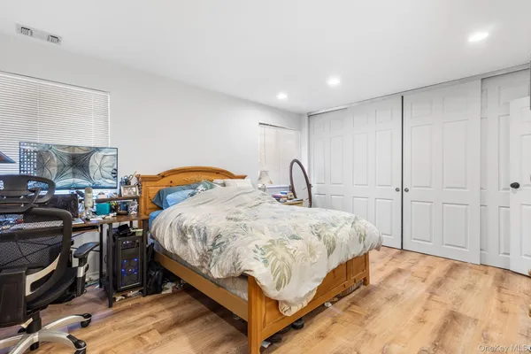 a bedroom with a bed and a cabinets