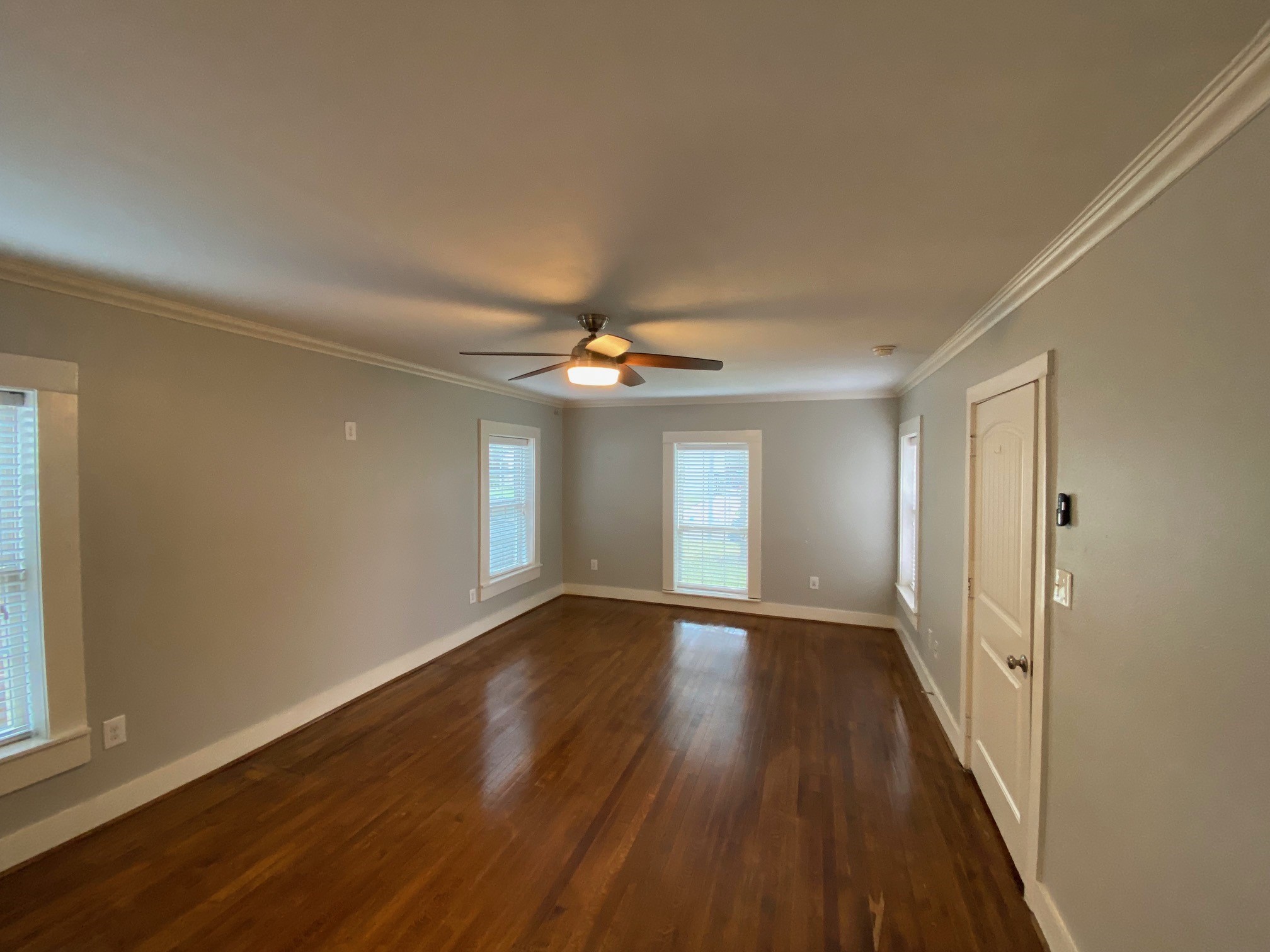 3209 Milburn Street Houston, TX 77021 - Photo 16 of 45 a view of an empty room with window and wooden floor