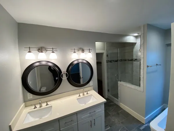 a bathroom with a sink and a mirror