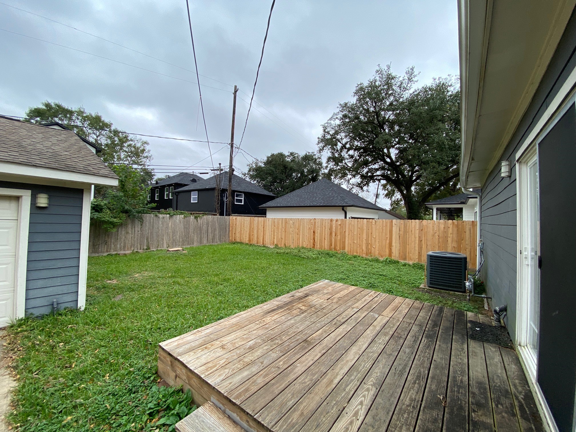 3209 Milburn Street Houston, TX 77021 - Photo 25 of 45 a view of a backyard with wooden floor