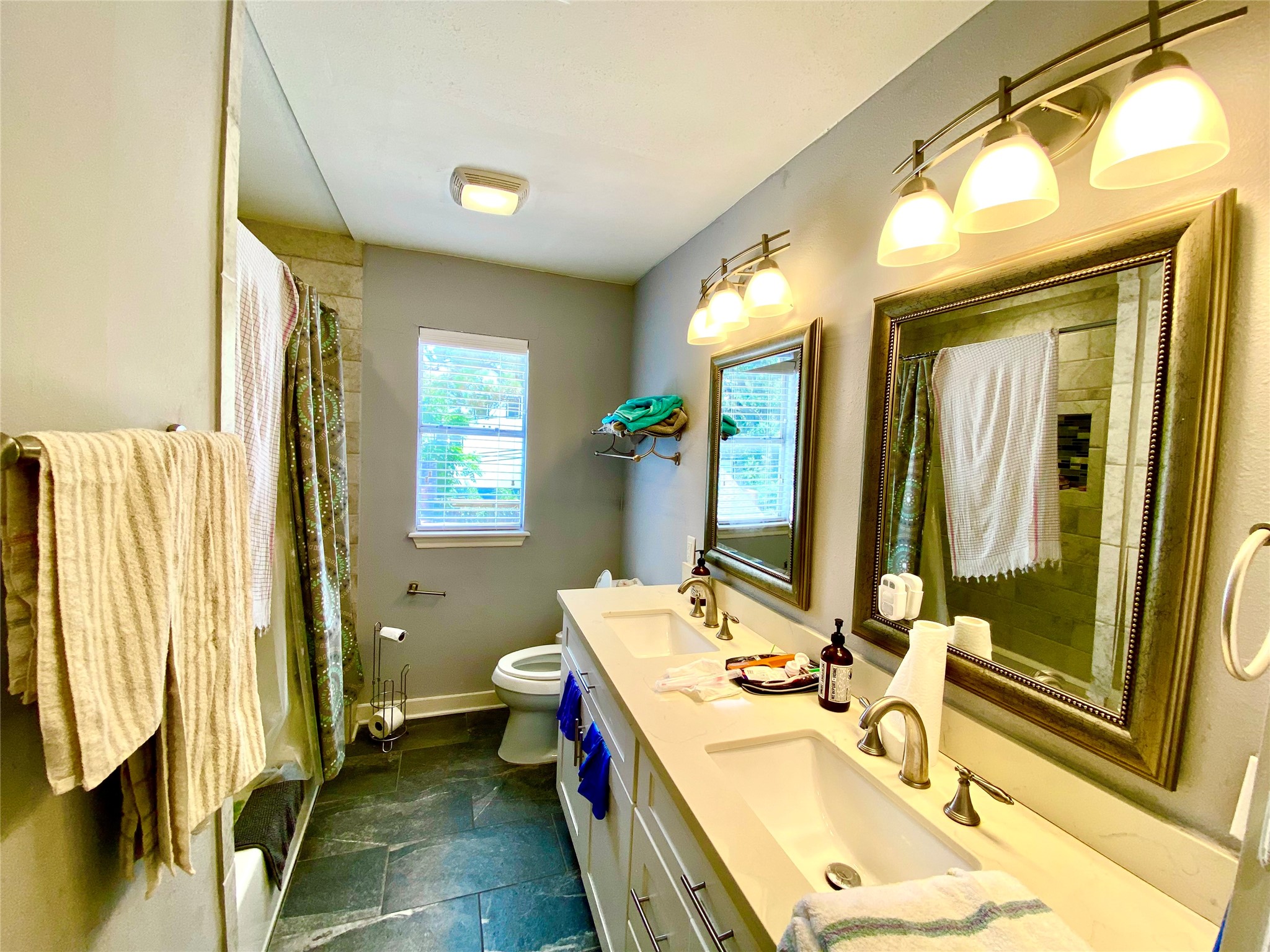 3209 Milburn Street Houston, TX 77021 - Photo 37 of 45 a bathroom with a sink mirror and a bathtub