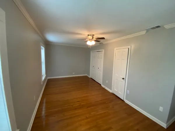 a view of a hallway with a chandelier