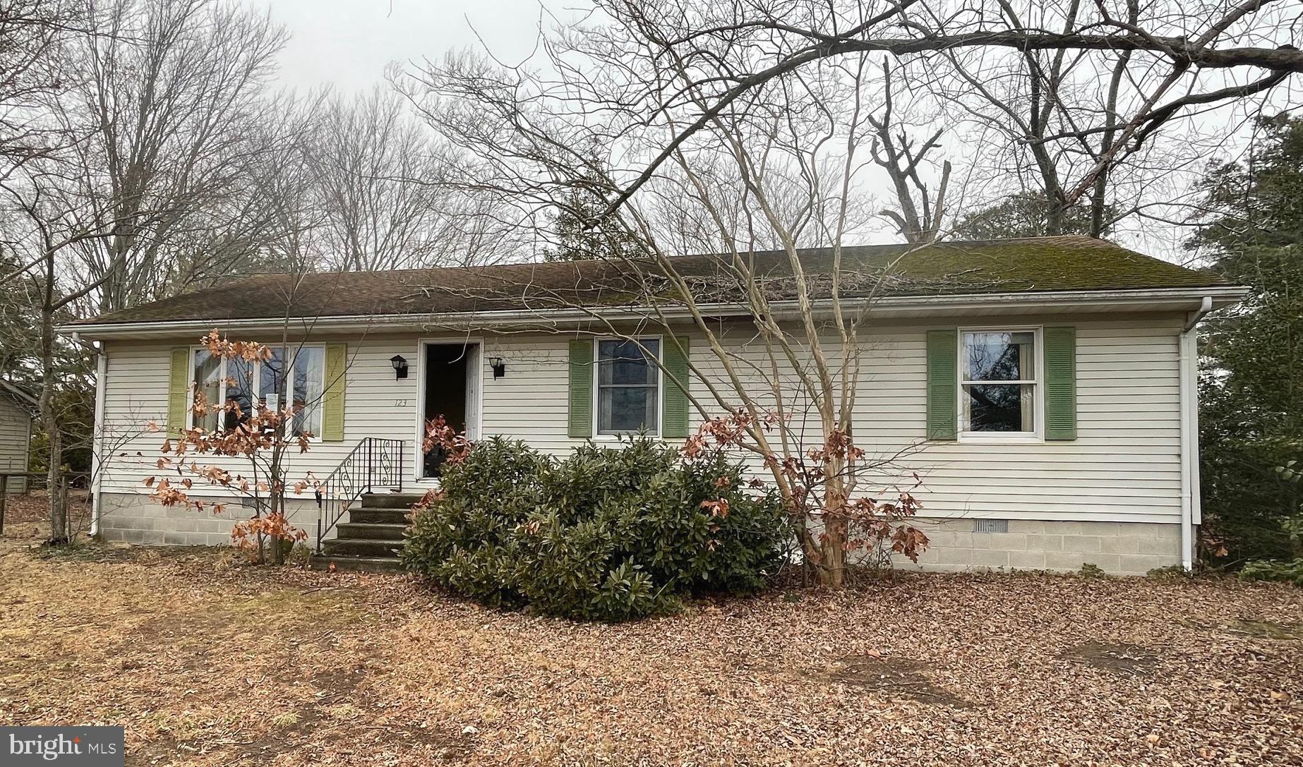 a front view of house with yard and seating space