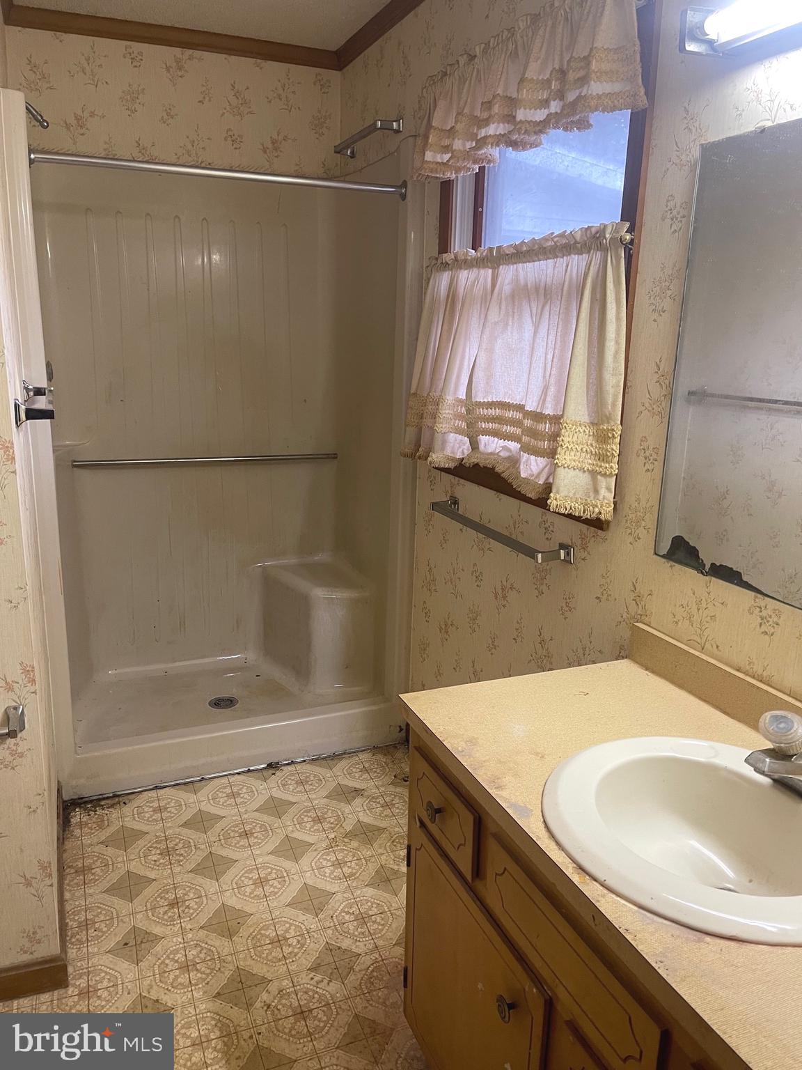 37339 Main Street Ocean View, DE 19970 - Photo 12 of 13 a bathroom with a sink and a shower