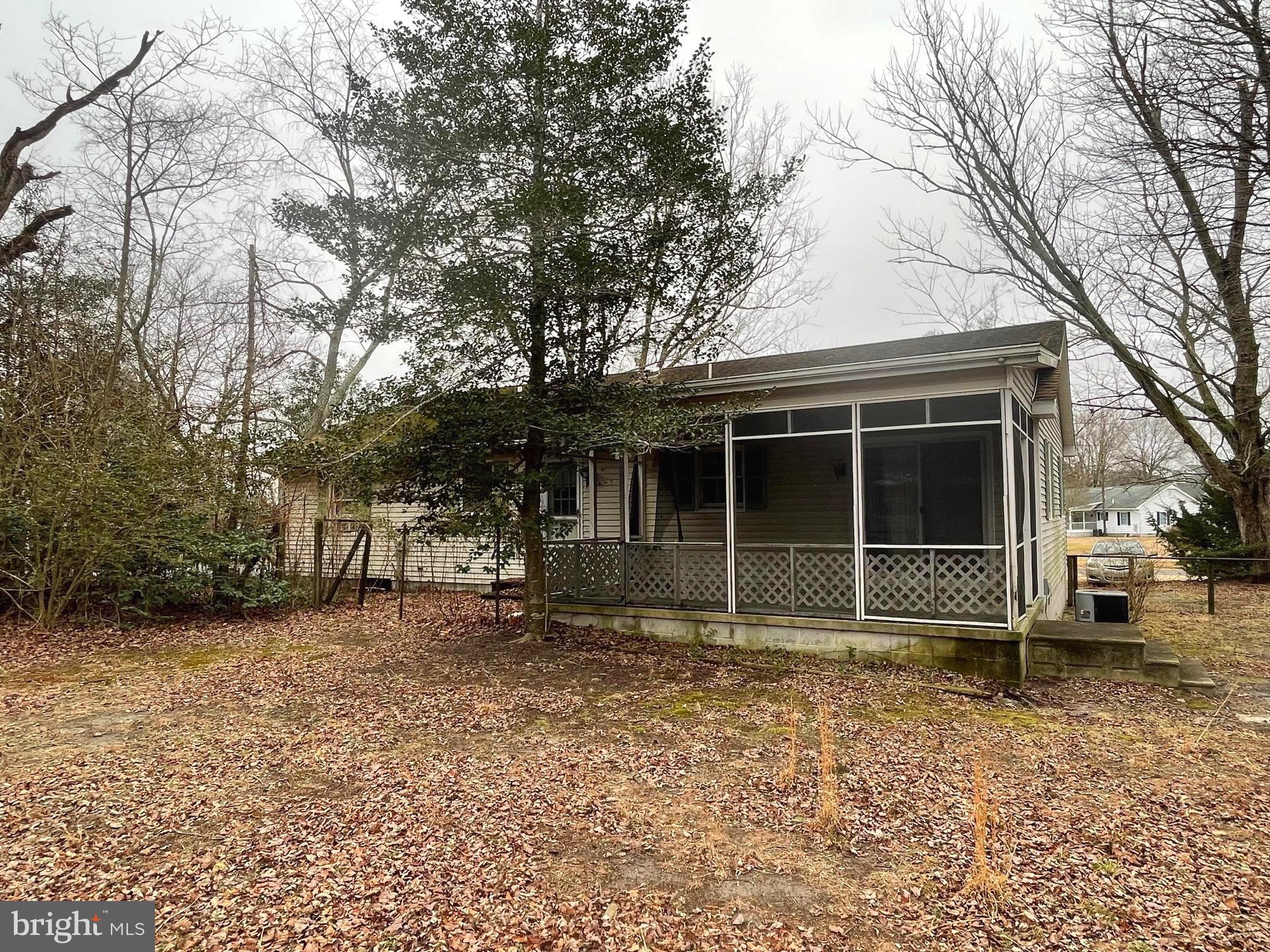 37339 Main Street Ocean View, DE 19970 - Photo 13 of 13 a house with trees in the background